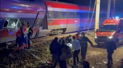 First responders search through wreckage after two high-speed trains derailed in Adamuz