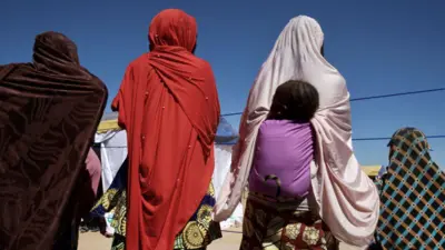 .Women backing camera