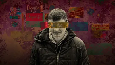 Крупний план юнака в темній куртці на тлі написів "Донбас - це Україна", "Встань на защиту Родины", "Обращайся в военные".