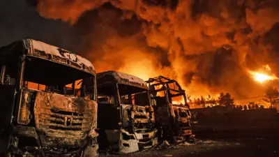 در پی حملات امریکا و اسرائیل، در انبار نفت شهران آتش‌سوزی رخ داد که باعث از کار افتادن تعداد زیادی تانکر نفت و موتر در آن منطقه در تهران، ایران در ۸ مارچ ۲۰۲۶ شد.