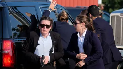 Secret Service agents around Donald Trump