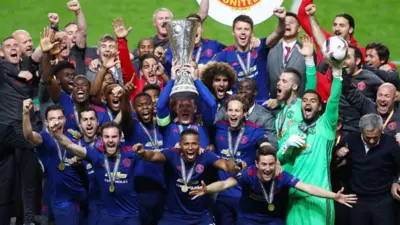 Manchester United lift the Europa League trophy