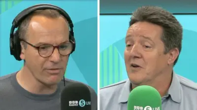 A composite image of Martin Lewis and Des. Martin wears headphones and has dark coloured glasses on and a grey round neck top. Des has short grey hair and is wearing a pale coloured top.