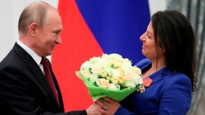 普京與RT老闆瑪格麗塔·西蒙尼揚（Margarita Simonyan）