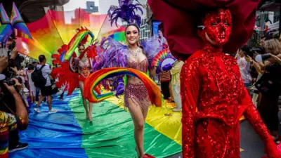 BANGKOK, THAILAND - JUNE 01: Participants march in the Bangkok Pride Parade on June 01, 2024 in Bangkok, Thailand. Members of the LGBTQ community and allies take part in a Pride month march through central Bangkok. Thailand is set to become the first Southeast Asian country to legalize same-sex marriage, with a bill passing Parliament's lower house and its first Senate reading. An second Senate reading is scheduled for later this month. (Photo by Lauren DeCicca/Getty Images)