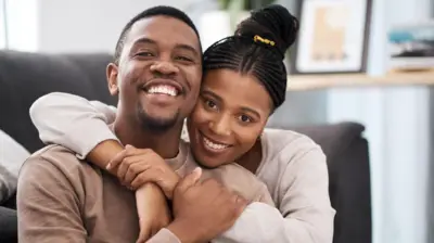 A man and a woman embracing each other