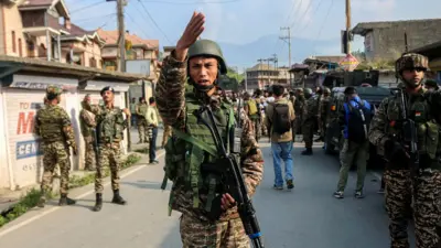 Indian paramilitary soldiers stand guard in Pampore, Pulwama district, south of Srinagar, Jammu and Kashmir, on May 7, 2025. 