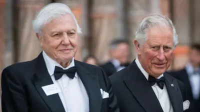 Sir David Attenborough and King Charles III in dinner jackets and bow ties