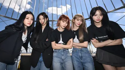 K-pop band Le Sserafim pose at the top of the Empire State Building in New York while promoting their fourth mini-album, Crazy