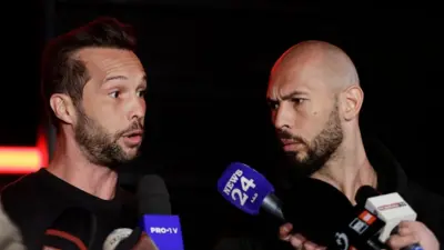 Tristan (left) and Andrew Tate speaking to members of the media in March 2025.
