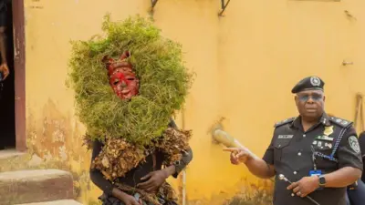 Akwa Ibom State Commissioner of Police, CP Baba Mohammed Azare with a masquerade dem arrest 