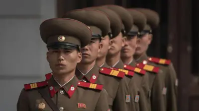 Korean People's Army (KPA) soldiers line up to take their positions prior to a military parade marking the 105th anniversary of the birth of late North Korean leader Kim Il-Sung, in Pyongyang 