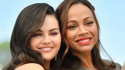 Selena Gomez and Zoe Saldana attends the "Emilia Perez" Photocall at the 77th annual Cannes Film Festival at Palais des Festivals on May 19, 2024 in Cannes, France