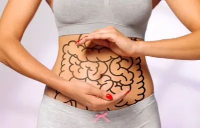 Woman with picture of intestines dem draw onto her stomach