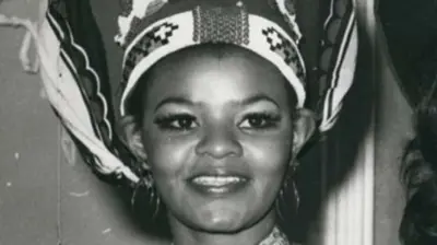 A black-and-white close up image of Cynthia Shange smiling
