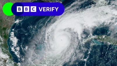 Satellite image of Hurricane Milton above the ocean, with tv Verify label in the top left corner.