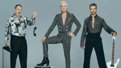 The Scissor Sisters pictured with a guitar, telephone and television set. Left to right: Babydaddy, Jake Shears and Del Marquis