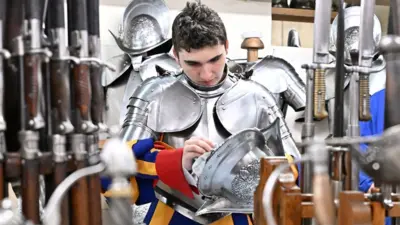 A soldier prepares for the oath of the Pontifical Swiss Guard in the Swiss Guard barracks in Vatican City, on April 30, 2024.