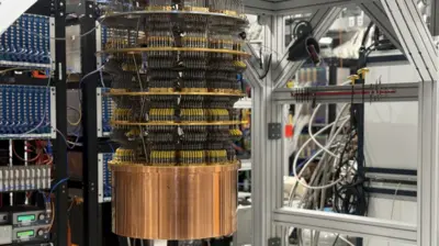 Google's Willow quantum computer is an oil barrel-sized series of round discs connected by hundreds of black control wires descending into a bronze drum suspended a metre from the ground in a lab.