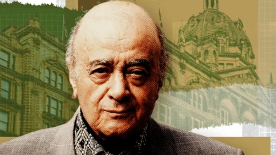 Picture of Mohamed Al Fayed - he has grey hair around the sides of his head and is bald on top, with a wrinkled face and heavy eyebrows. His mouth is slightly pursed and he is looking at the camera. He wears a grey suit jacket, black and white patterned shirt and a cravatte. Behind him is the Harrods logo in gold, and the building, with a treatment to make it look gold and green.