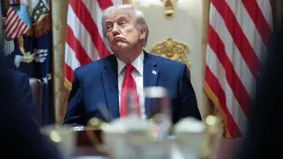 Trump at the table making "not impressed" face