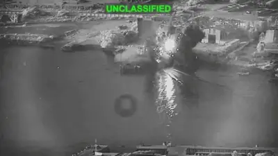 Tangkapan layar dari video yang dirilis militer AS pada 13 Juli, yang menurut mereka menunjukkan serangan terhadap sebuah fasilitas pemeliharaan di Bandar Abbas, Iran.