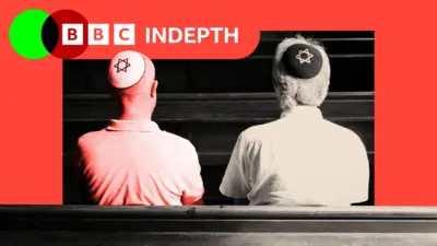 A treated image of two Jewish men sitting together inside a synagogue Copyright