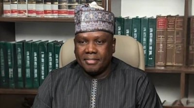 Daniel Bwala on cap wit books by im side