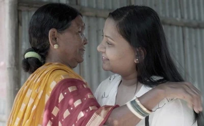 Siro, and Indian midwife, greets Monica - now in her 20s, who the BBC believes was among the girls saved by Siro and other midwives when they were babies