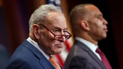 US Senate Minority Leader Chuck Schumer (L) during a press conference with House Minority Leader Hakeem Jeffries (R) 