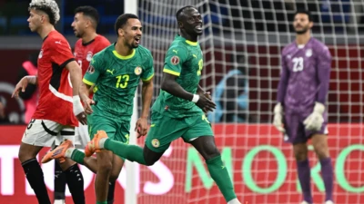 Mane. Ndiaye celebrate after scoring as El Shenaawy is left dejected