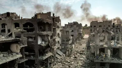 Aerial view of buildings destroyed by Israeli air strikes in Jabalia camp for Palestinian refugees in Gaza City This picture taken on 11 October 2023 