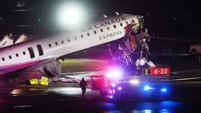 An Air Canada Express plane sits on the tarmac after it collided with a fire truck on the tarmac at LaGuardia Airport on March 23, 2026 in New York City.