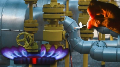 колаж - газова комфорка на тлі газових труб