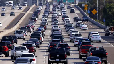 Drivers sit in traffic on Interstate 5 during the afternoon commute heading into downtown San Diego on October 4, 2024 in San Diego, California, US
