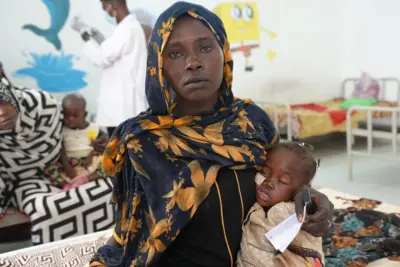 Mother Ikram with three-year-old Manasek who is suffering from severe malnutrition