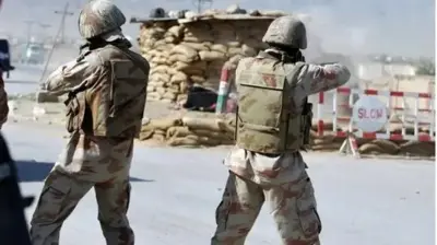 Pakistani security personnel are guarding a checkpoint in border region