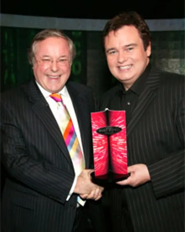 Телеведущий Иманн Холмс