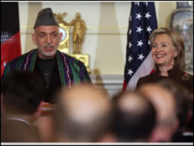 كرزاي وكلينتون