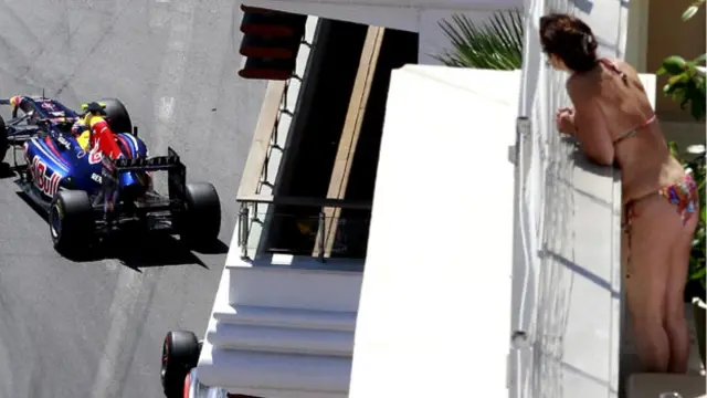 Aksi Sebastian Vettel di sirkuit Monaco, yang dikenal karena jalur balap yang tajam dan berliku-liku, menarik perhatian warga yang tengah menikmati sinar matahari.