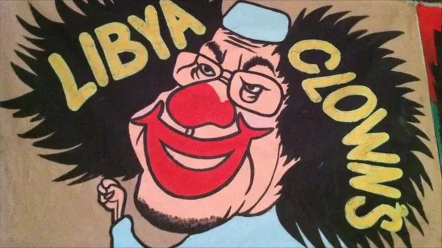Карикатура на Каддафи с лицом клоуна