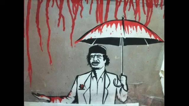 Карикатура на Каддафи под кровавым дождем