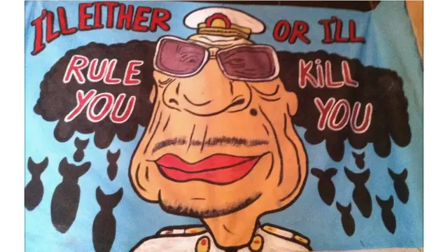 Para artis coretan dinding tampaknya memilih untuk menargetkan pemimpin Libia yang flamboyan ini.