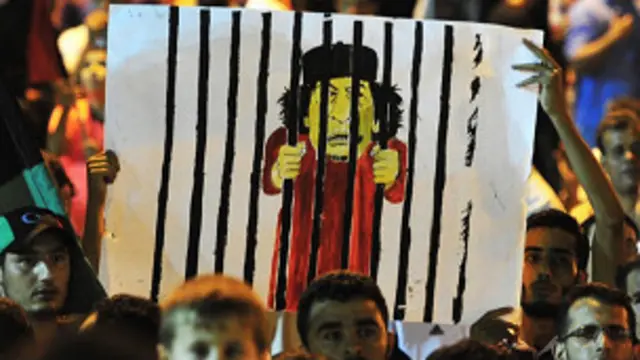 Tranh biếm họa mang hình Gaddafi