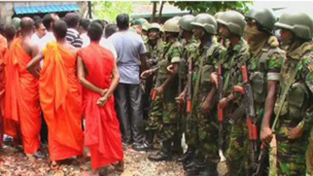 A group led by Buddhist monks attacking a mosque in Dambulla (file photo)