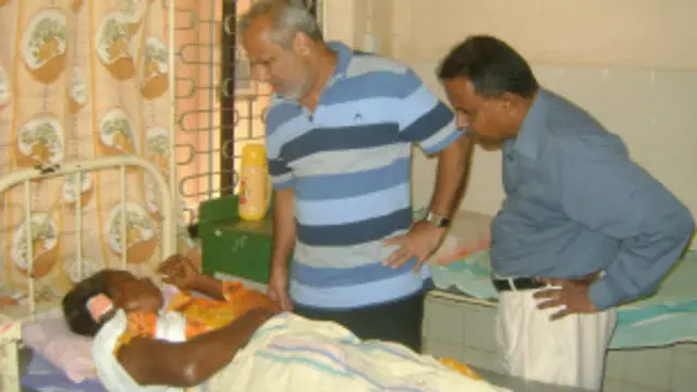 Minister Hakeem visiting the victim at the hospital