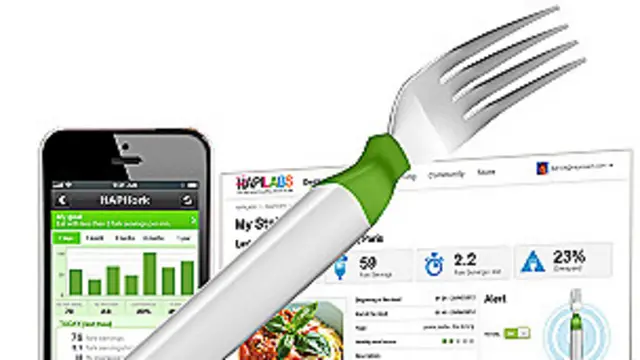 Computadora y tenedor