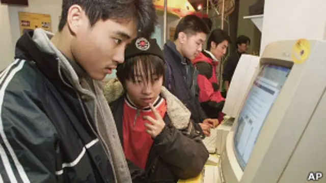 chinese student are surfing on the internet, AP