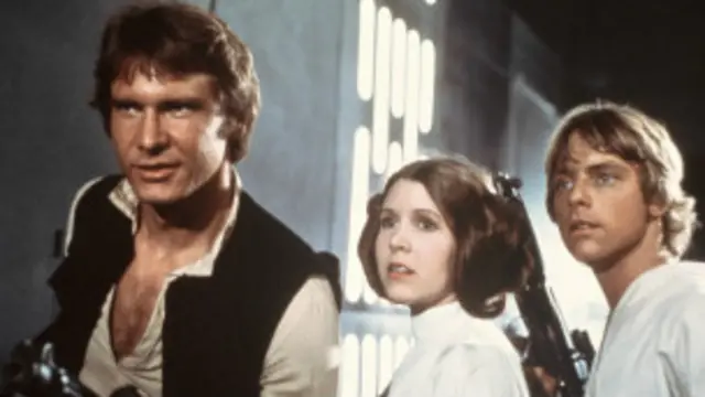 Para pemain fil Star Wars edisi pertama, Harrison Ford (kiri), Carrie Fisher dan Mark Hamill.