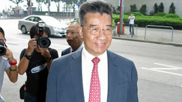 刘梦熊抵达香港东区裁判法院（BBC中文网图片21/8/2013）